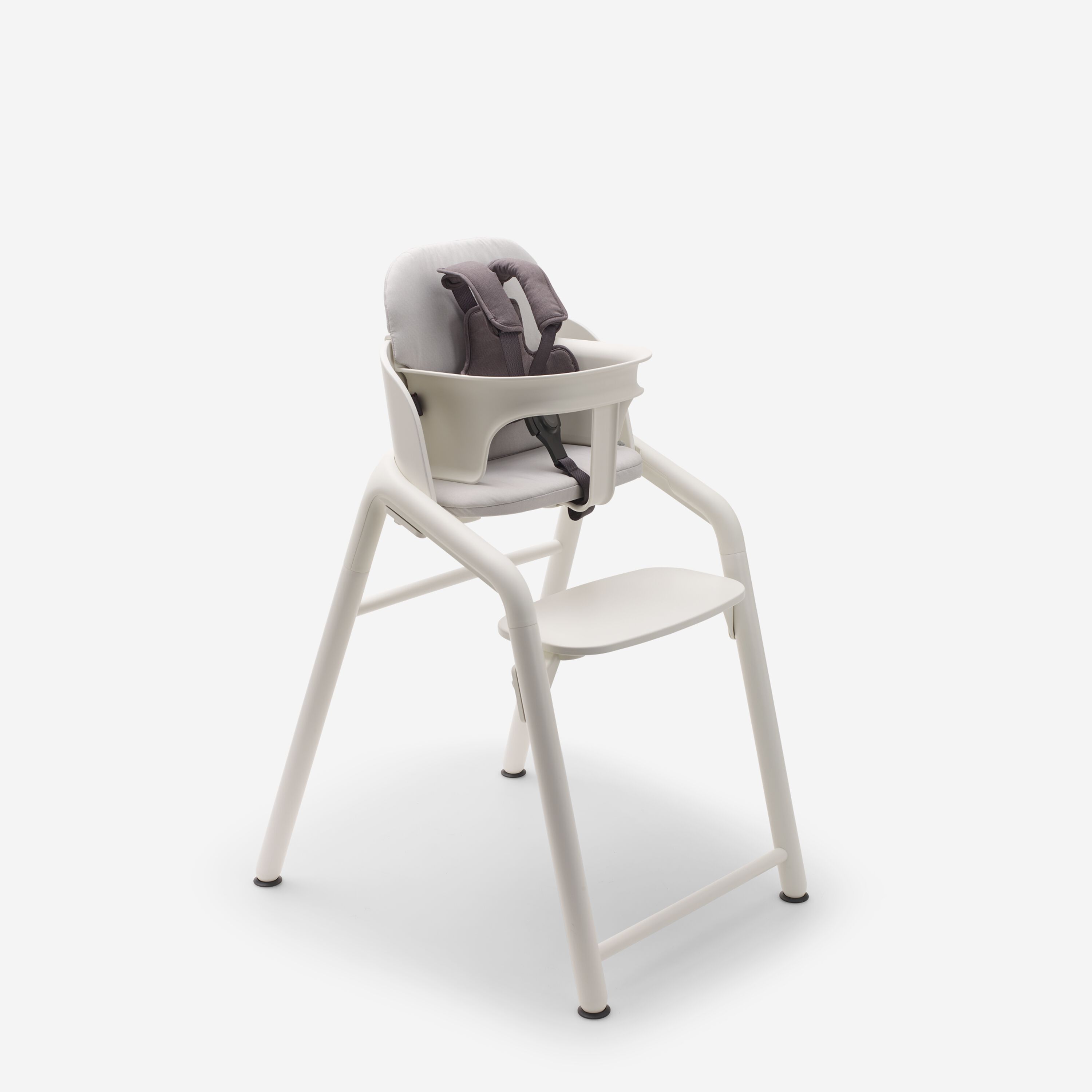 Bugaboo Giraffe chair, baby set with harness, and baby pillow set, all in white. - Main Modal Image Slide 3 of 4