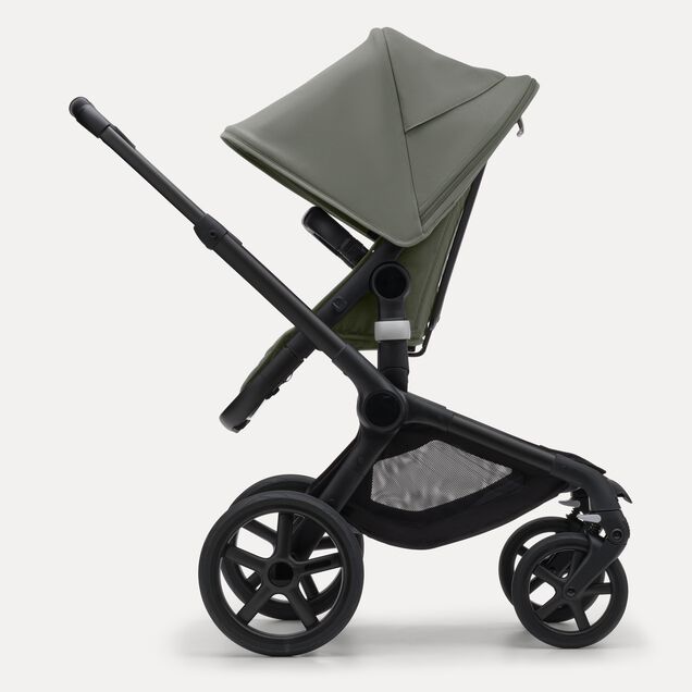 Side view of the Bugaboo Fox 5 seat pram with black chassis, forest green fabrics and forest green sun canopy. - Main Image Slide 3 of 12