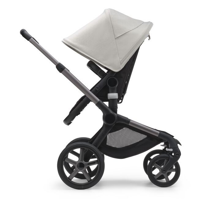 Side view of the Bugaboo Fox 5 seat stroller with graphite chassis, midnight black fabrics and misty white sun canopy. - Main Image Slide 4 of 15