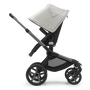 Side view of the Bugaboo Fox 5 seat stroller with graphite chassis, midnight black fabrics and misty white sun canopy. - Thumbnail Modal Image Slide 4 of 15
