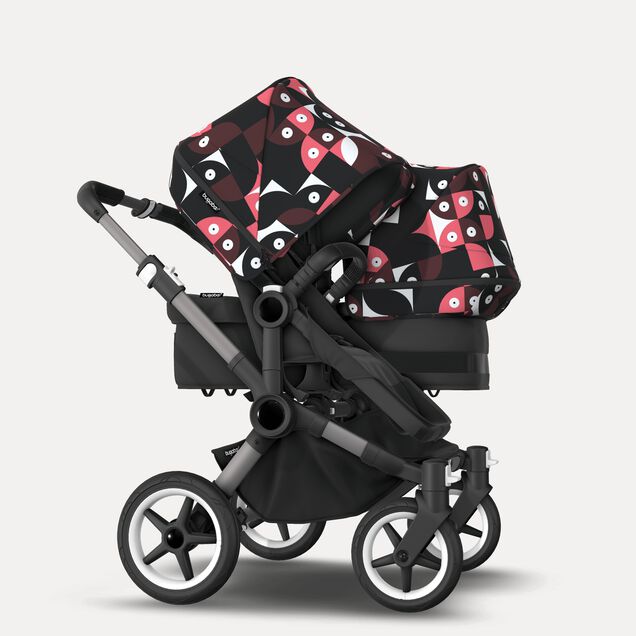 Bugaboo Donkey 5 Duo double stroller graphite base, midnight black fabrics, animal explorer pink/ red sun canopy - Main Image Slide 2 of 10