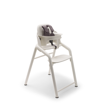 Bugaboo Giraffe chair and baby set with harness in white.