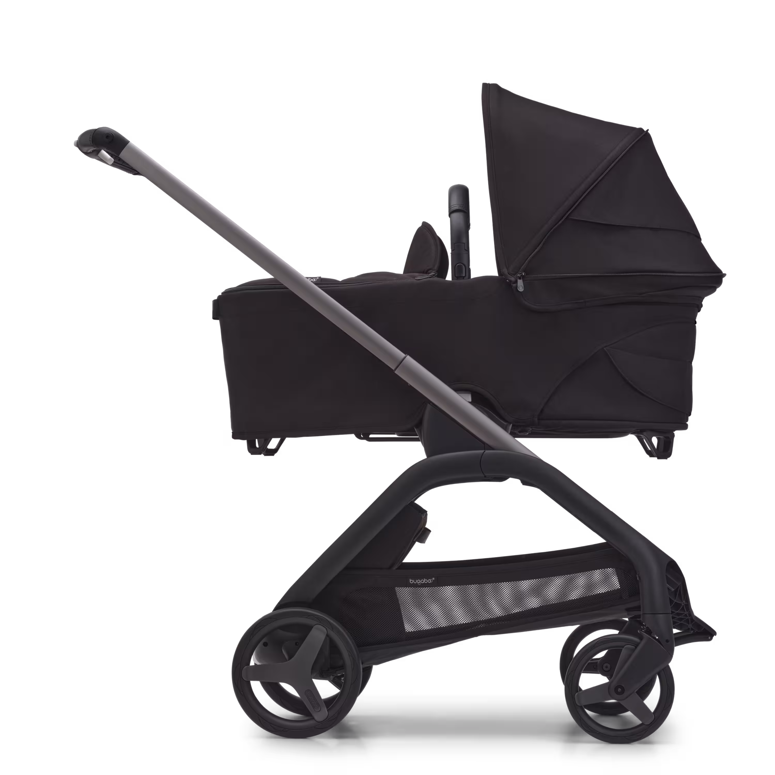 Side view of the Bugaboo Dragonfly bassinet stroller with graphite chassis, midnight black fabrics and midnight black sun canopy. - Main Modal Image Slide 3 of 16