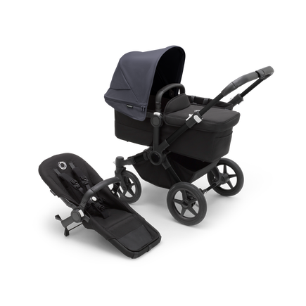 Bugaboo Donkey 5 Mono bassinet stroller with black chassis, midnight black fabrics and stormy blue sun canopy, plus seat.