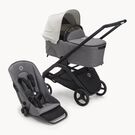 Bugaboo Dragonfly bassinet and seat stroller with black chassis, grey melange fabrics and misty white sun canopy.