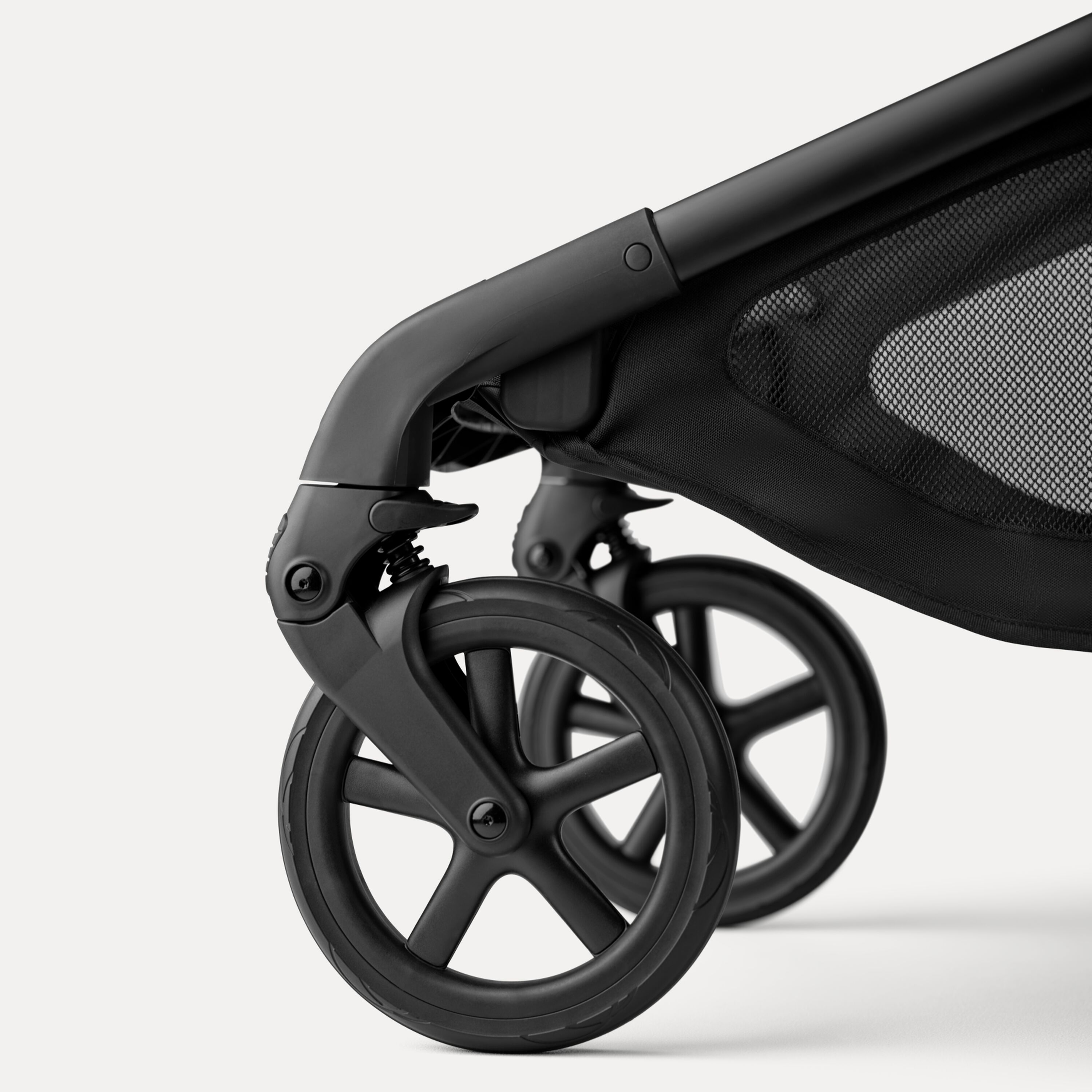 A close-up of the front wheels of the Bugaboo Kangaroo 2-in-1 stroller. - Main Modal Image Slide 9 of 18