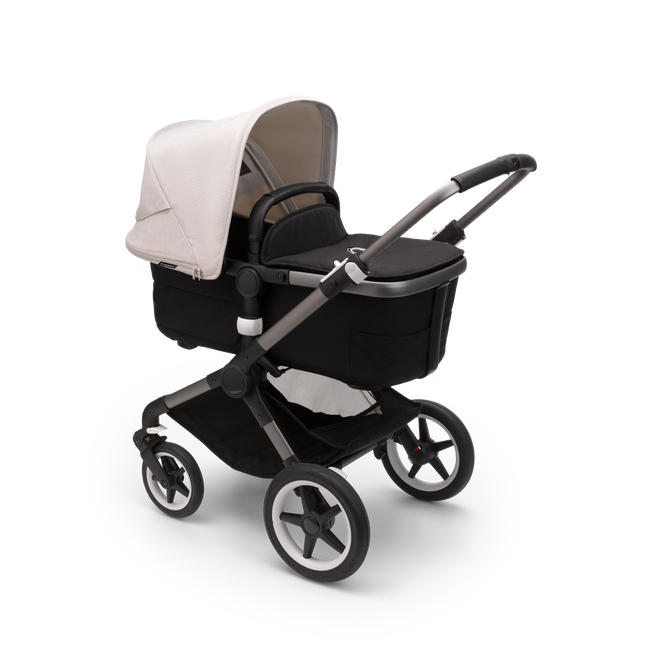 Bugaboo Fox 3 bassinet stroller with graphite frame, black fabrics, and white sun canopy.