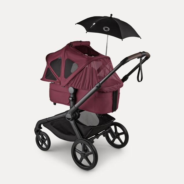 Bugaboo Kangaroo 2-in-1 stroller with a bassinet and a breezy sun canopy in Dark Cherry fabrics and a black parasol. The sun canopy is fully extended with the mosquito net covering the bassinet. - Main Image Slide 17 of 18