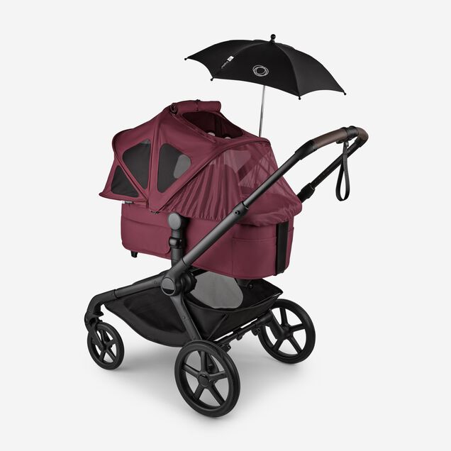 Bugaboo Kangaroo 2-in-1 stroller with a bassinet and a breezy sun canopy in Dark Cherry fabrics and a black parasol. The sun canopy is fully extended with the mosquito net covering the bassinet. - Main Image Slide 17 of 18