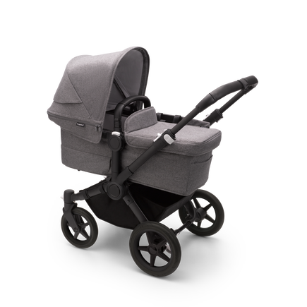 Bugaboo Donkey 5 Mono bassinet stroller with black chassis, grey melange fabrics and grey melange sun canopy.