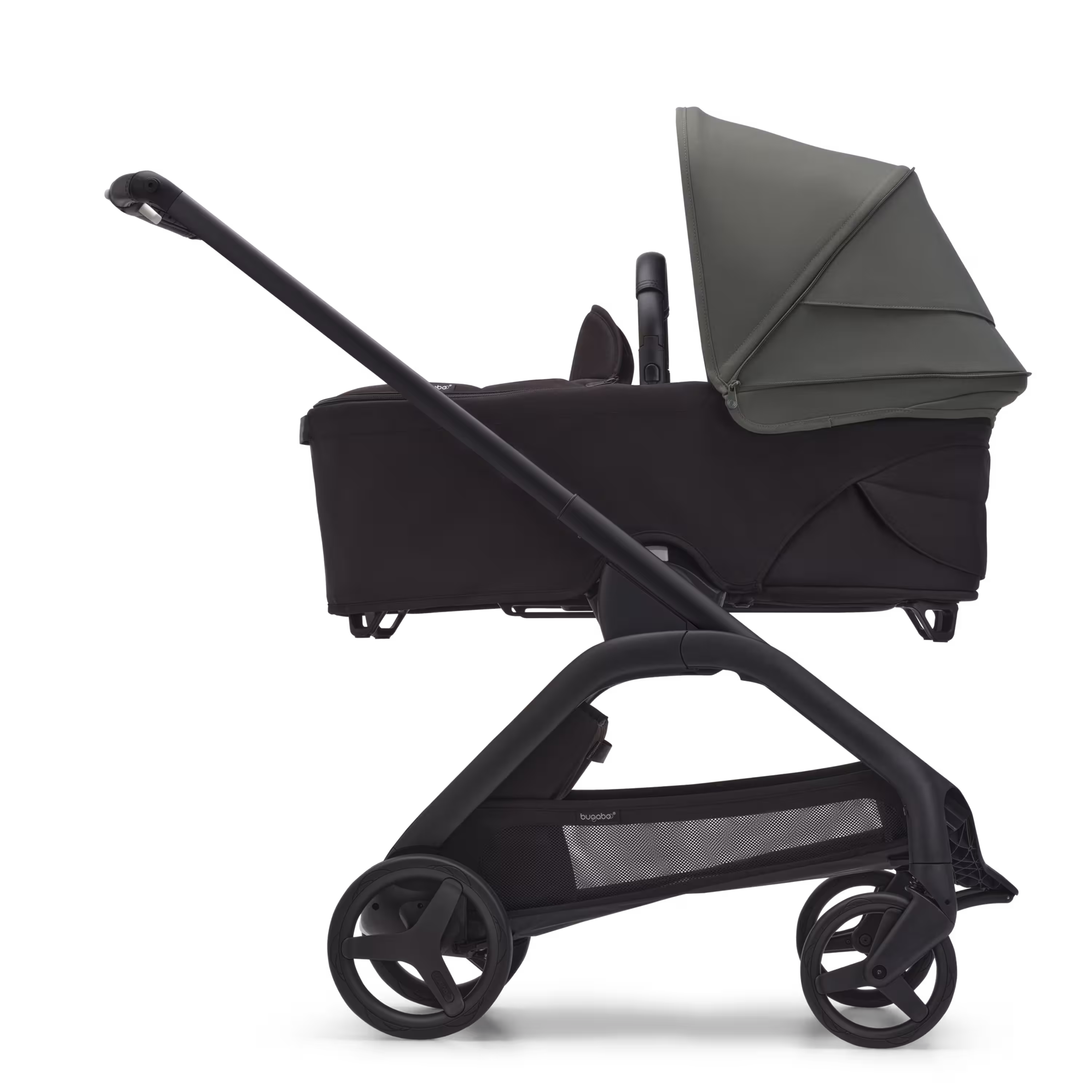 Side view of the Bugaboo Dragonfly bassinet stroller with black chassis, midnight black fabrics and forest green sun canopy. - Main Modal Image Slide 3 of 16