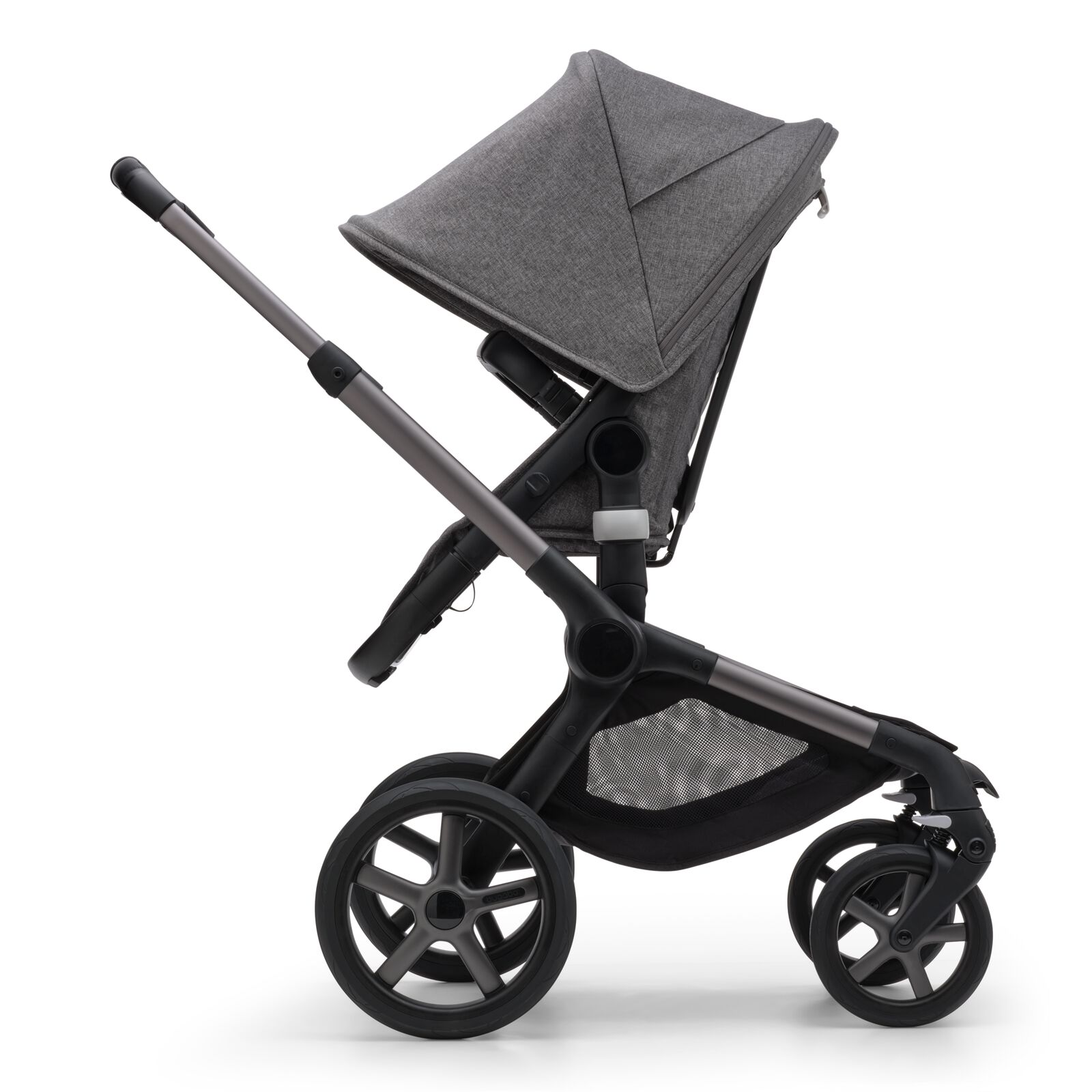 Side view of the Bugaboo Fox 5 seat stroller with graphite chassis, grey melange fabrics and grey melange sun canopy.