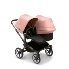Bugaboo Donkey 5 Duo bassinet and seat stroller graphite base, midnight black fabrics, morning pink sun canopy