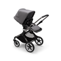 Bugaboo Fox 3 seat stroller with graphite frame, grey fabrics, and grey sun canopy.