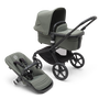 Bugaboo Fox 5 bassinet and seat stroller with black chassis, forest green fabrics and forest green sun canopy.