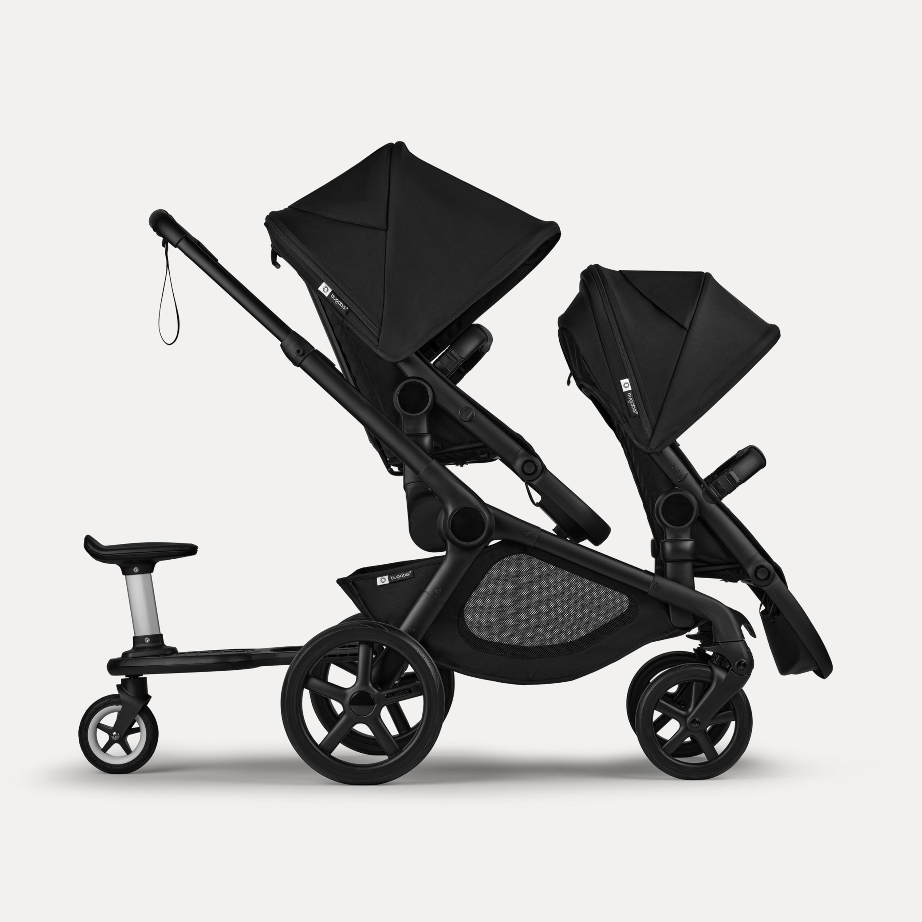 Bugaboo Kangaroo 2-in-1 tandem stroller with two seats and a wheeled board, with Midnight Black fabrics and Midnight Black sun canopies. - Main Modal Image Slide 7 of 18