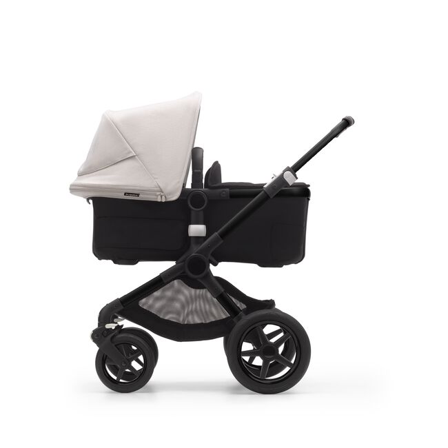 Side view of a Bugaboo Fox 3 pram body stroller with black frame, black fabrics, and white sun canopy. - Main Image Slide 9 of 9