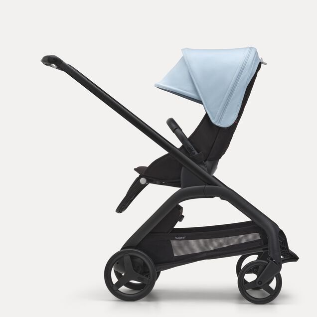 Side view of the Bugaboo Dragonfly seat stroller with black chassis, midnight black fabrics and skyline blue sun canopy. - Main Image Slide 2 of 16