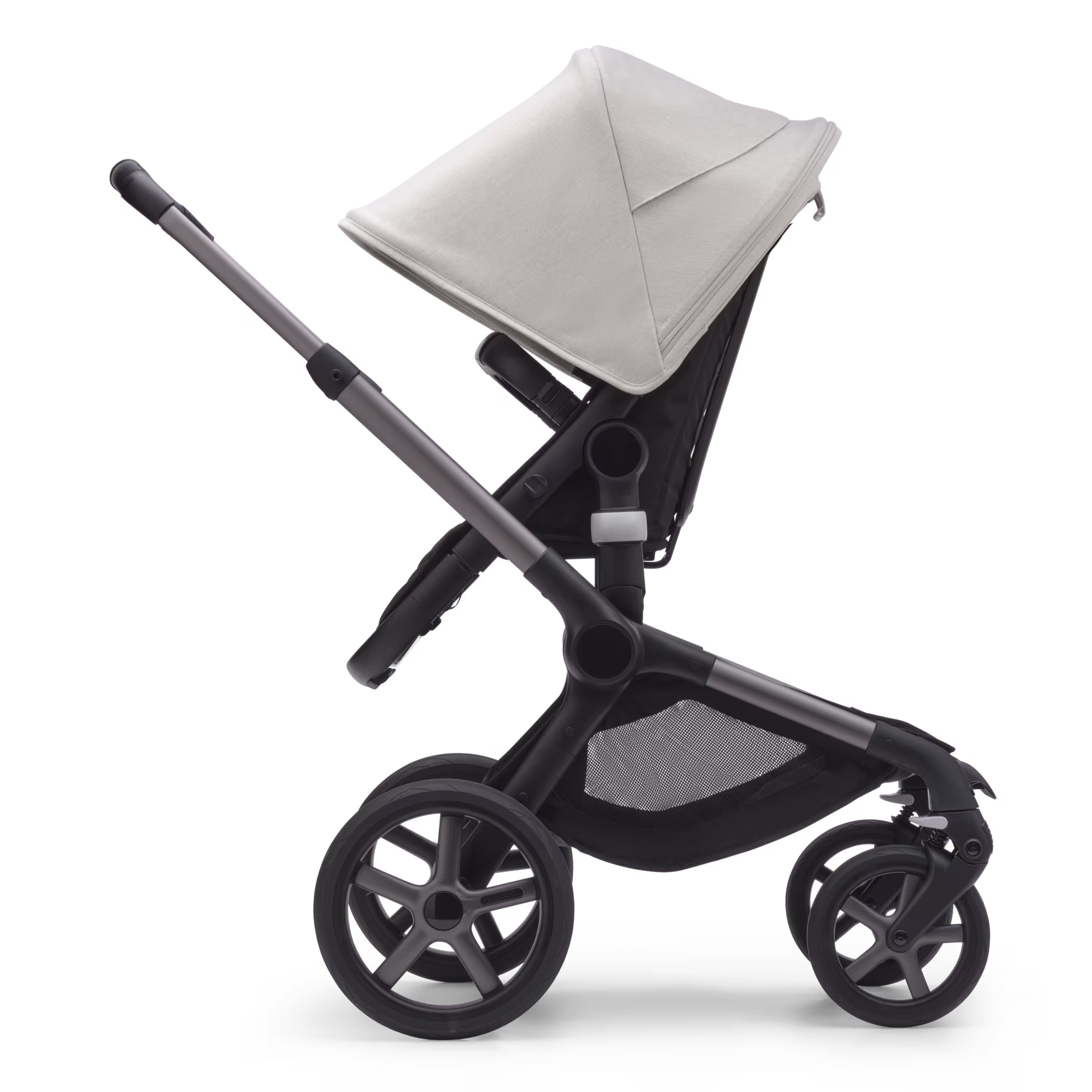 Side view of the Bugaboo Fox 5 carrycot pushchair with graphite chassis, midnight black fabrics and misty white sun canopy. - Main Modal Image Slide 3 of 13