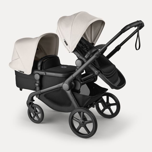Bugaboo Kangaroo 2-in-1 tandem stroller with one seat above and one bassinet below, with Midnight Black fabrics and Misty White sun canopies. - Main Image Slide 3 of 18
