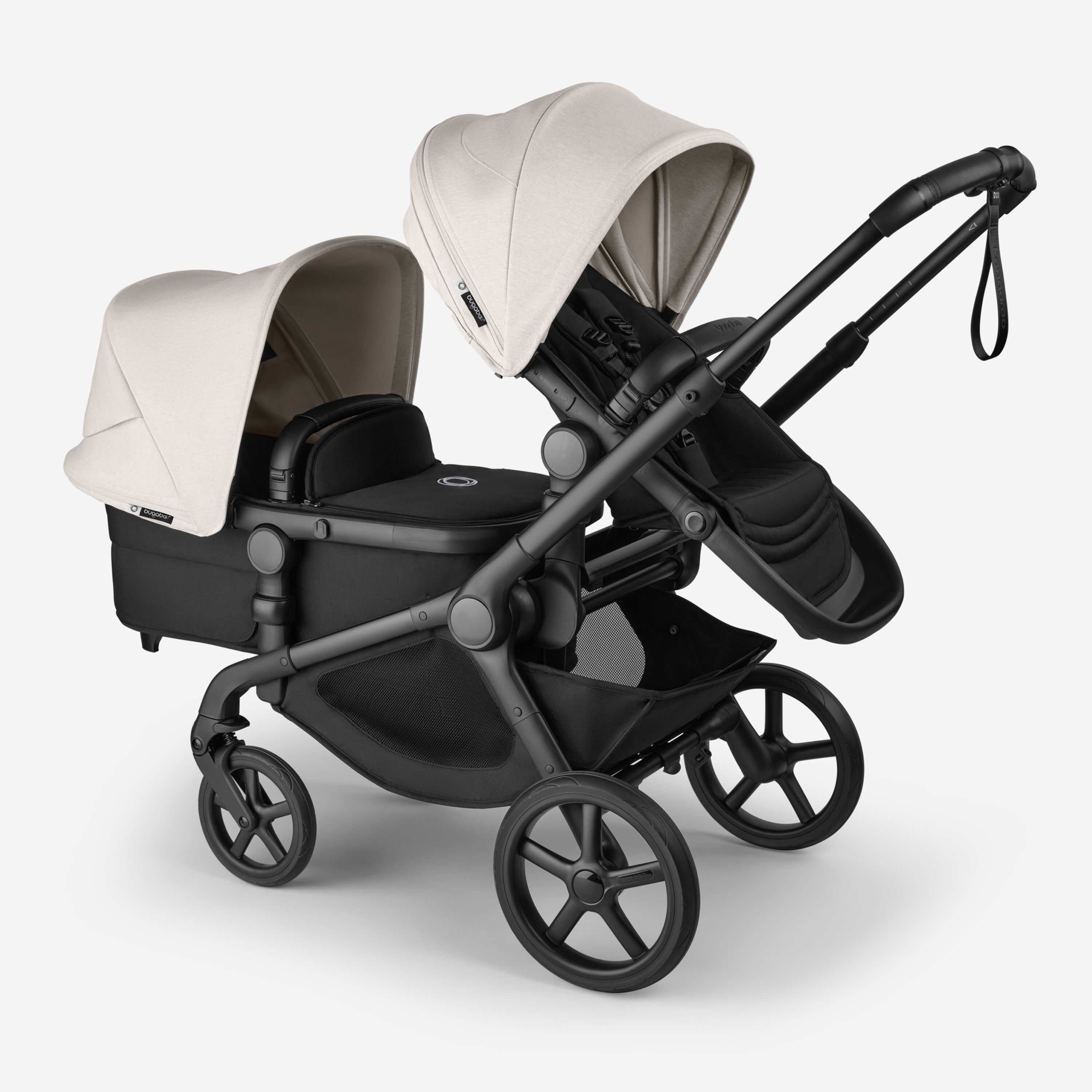 Bugaboo Kangaroo 2-in-1 tandem stroller with one seat above and one bassinet below, with Midnight Black fabrics and Misty White sun canopies. - Main Modal Image Slide 3 of 18
