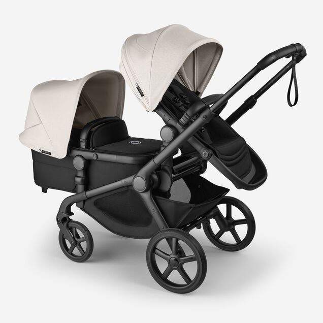 Bugaboo Kangaroo 2-in-1 tandem stroller with one seat above and one bassinet below, with Midnight Black fabrics and Misty White sun canopies. - Main Image Slide 3 of 18