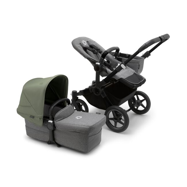 Bugaboo Donkey 5 Mono seat stroller with black chassis and grey melange fabrics, plus bassinet with forest green sun canopy.