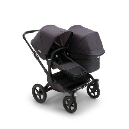 Bugaboo Donkey 5 Duo seat and bassinet stroller with black chassis, mineral washed black fabrics and mineral washed black sun canopy.