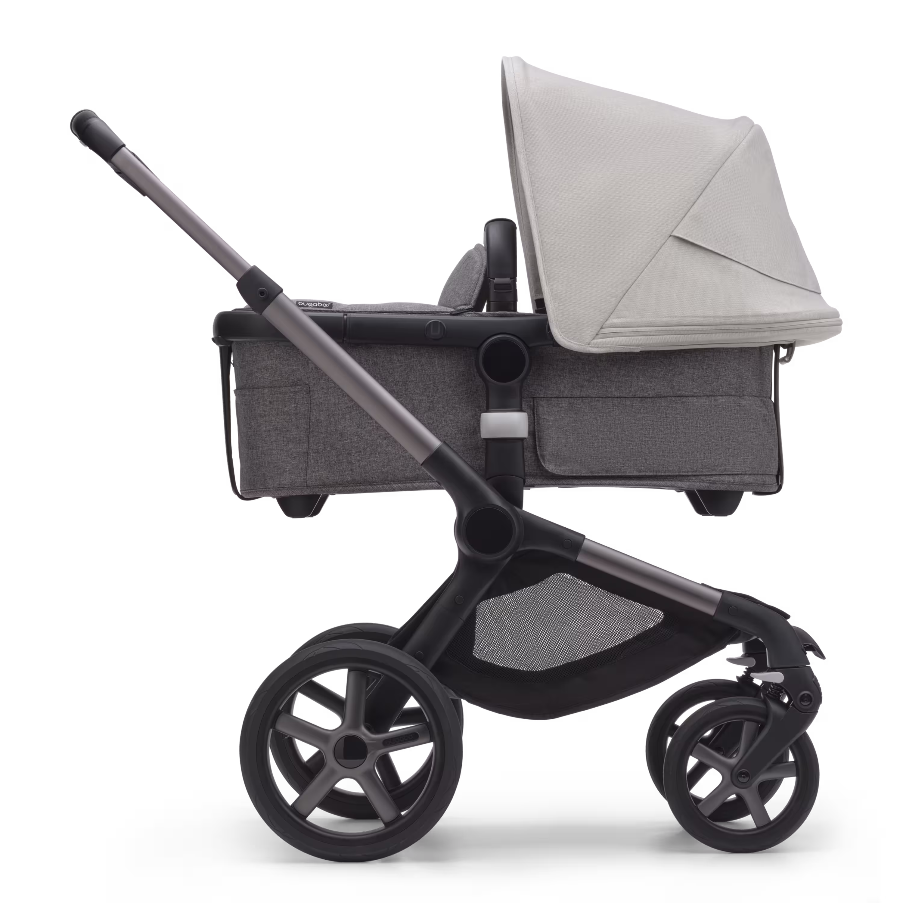 Side view of the Bugaboo Fox 5 carrycot pushchair with graphite chassis, grey melange fabrics and misty white sun canopy. - Main Modal Image Slide 2 of 13