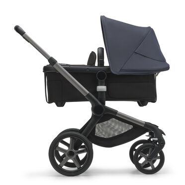 Side view of the Bugaboo Fox 5 carrycot pushchair with graphite chassis, midnight black fabrics and stormy blue sun canopy. - view 2