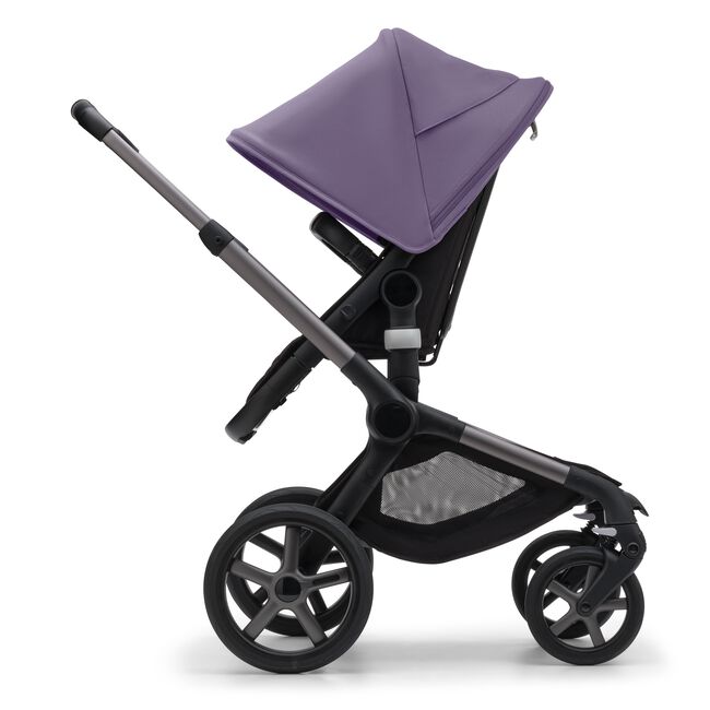 Side view of the Bugaboo Fox 5 seat stroller with graphite chassis, midnight black fabrics and astro purple sun canopy.