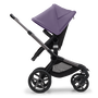 Side view of the Bugaboo Fox 5 seat stroller with graphite chassis, midnight black fabrics and astro purple sun canopy. - Thumbnail Slide 4 of 15