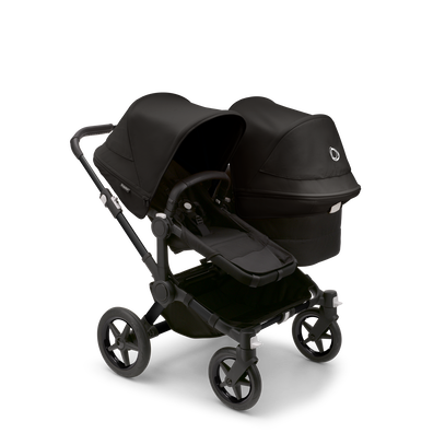 Bugaboo Donkey 5 Duo seat and bassinet stroller with black chassis, midnight black fabrics and midnight black sun canopy.