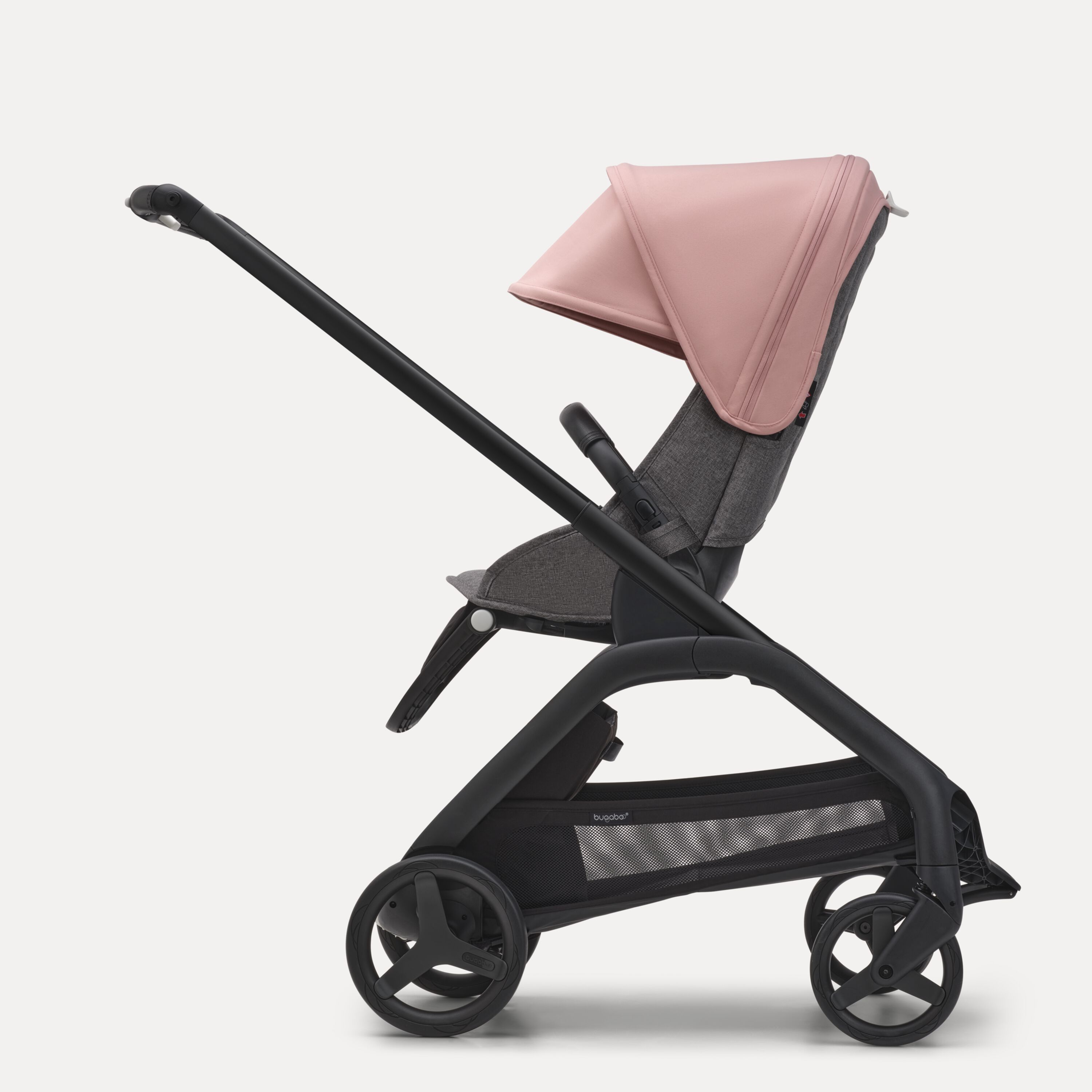 Side view of the Bugaboo Dragonfly seat stroller with black chassis, grey melange fabrics and morning pink sun canopy. - Main Modal Image Slide 2 of 16