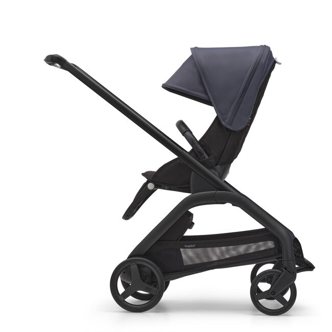 Side view of the Bugaboo Dragonfly seat stroller with black chassis, midnight black fabrics and stormy blue sun canopy.