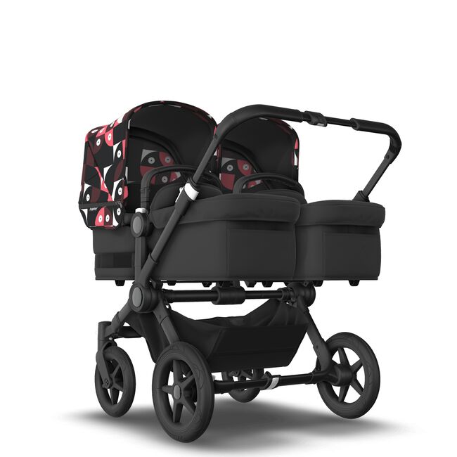 Bugaboo Donkey 5 Twin bassinet and seat stroller black base, midnight black fabrics, animal explorer pink/red sun canopy