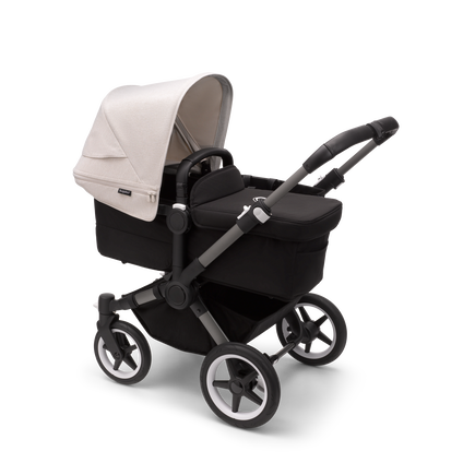Bugaboo Donkey 5 Mono bassinet stroller with graphite chassis, midnight black fabrics and misty white sun canopy.