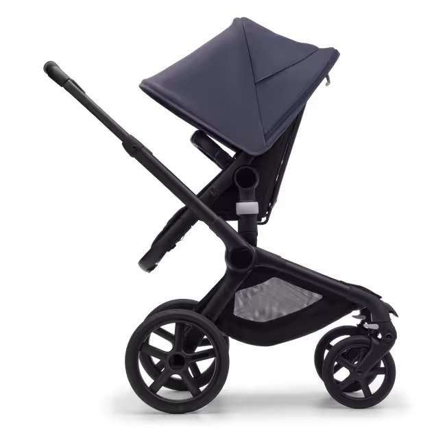 Side view of the Bugaboo Fox 5 seat pushchair with black chassis, midnight black fabrics and stormy blue sun canopy. - Main Image Slide 3 of 13