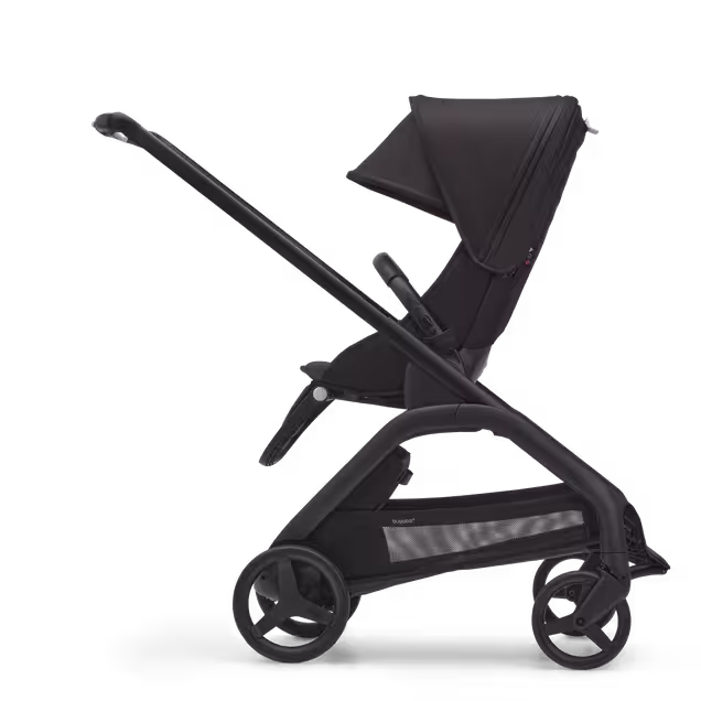 Side view of the Bugaboo Dragonfly seat pram with black chassis, midnight black fabrics and midnight black sun canopy. - Main Image Slide 2 of 16
