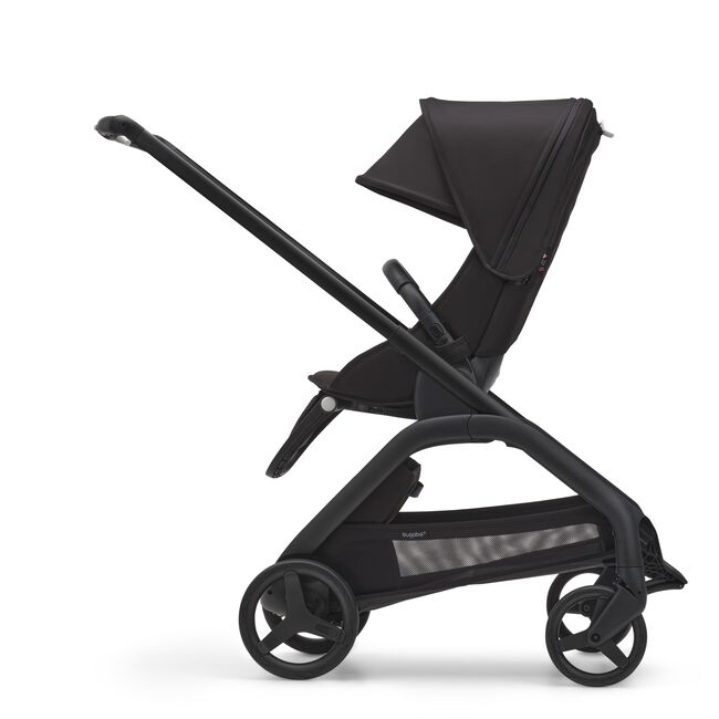 Side view of the Bugaboo Dragonfly seat pram with black chassis, midnight black fabrics and midnight black sun canopy.