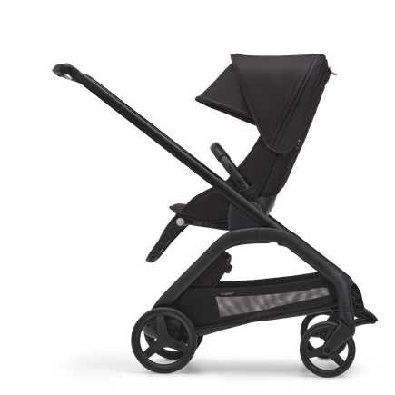 Side view of the Bugaboo Dragonfly seat pram with black chassis, midnight black fabrics and midnight black sun canopy.