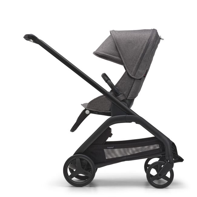 Side view of the Bugaboo Dragonfly seat stroller with black chassis, grey melange fabrics and grey melange sun canopy.