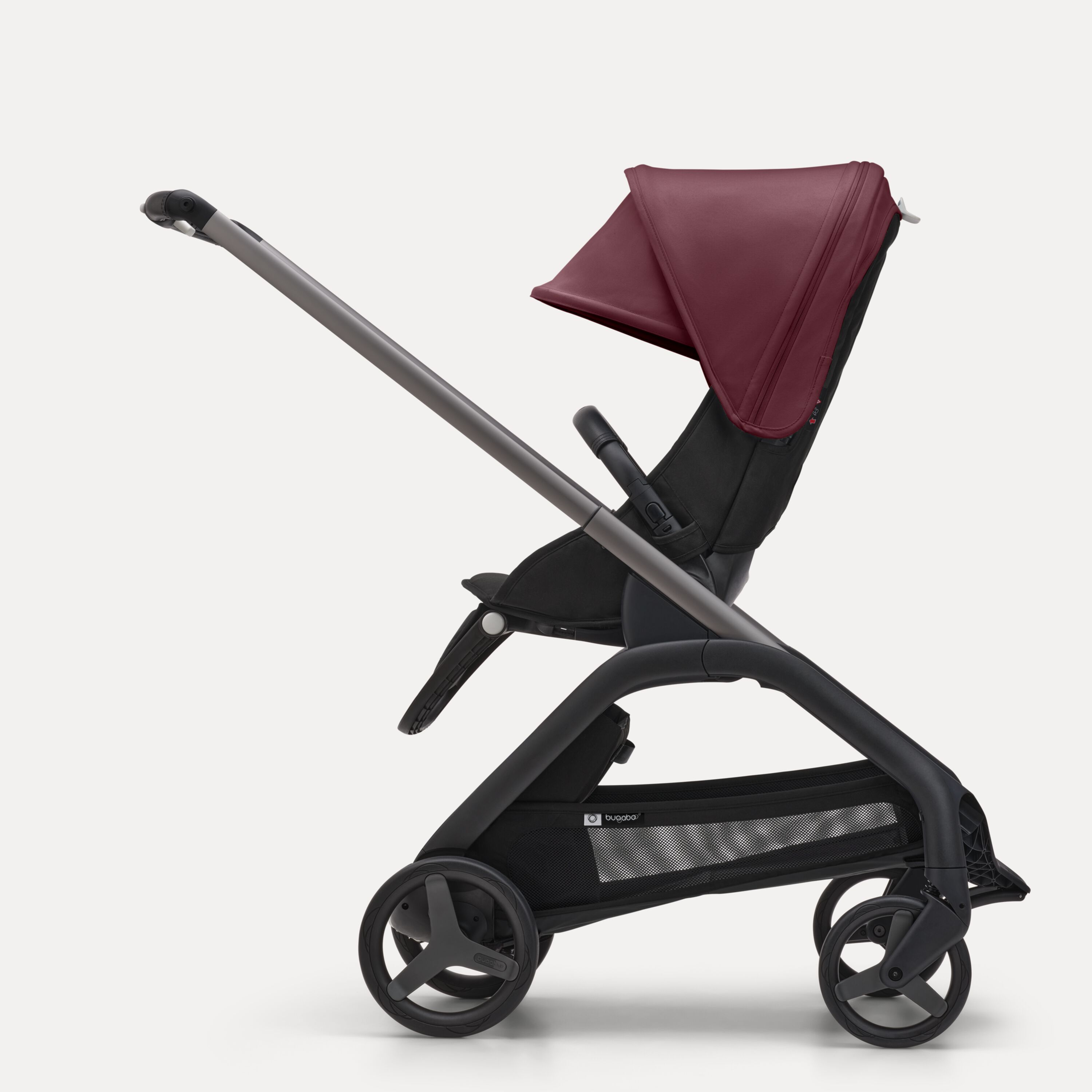 ブラックのシャーシ、グレーメランジのファブリック、グレーメランジのサンキャノピーを装着したバガブー ドラゴンフライ シートストローラーの横からの外観。 - Main Modal Image Slide 2 of 16