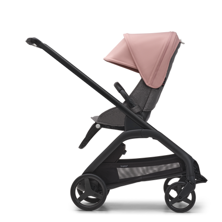 Side view of the Bugaboo Dragonfly seat stroller with black chassis, grey melange fabrics and morning pink sun canopy.