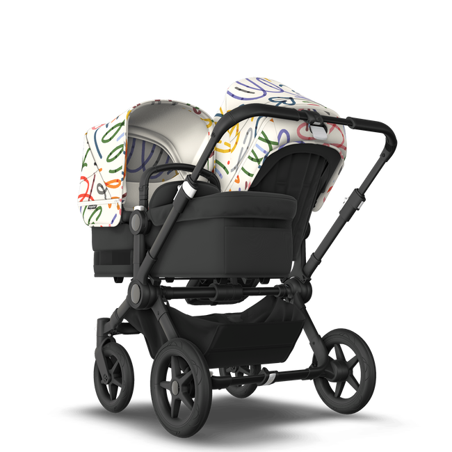 Bugaboo Donkey 5 Duo bassinet and seat stroller black base, midnight black fabrics, art of discovery white sun canopy