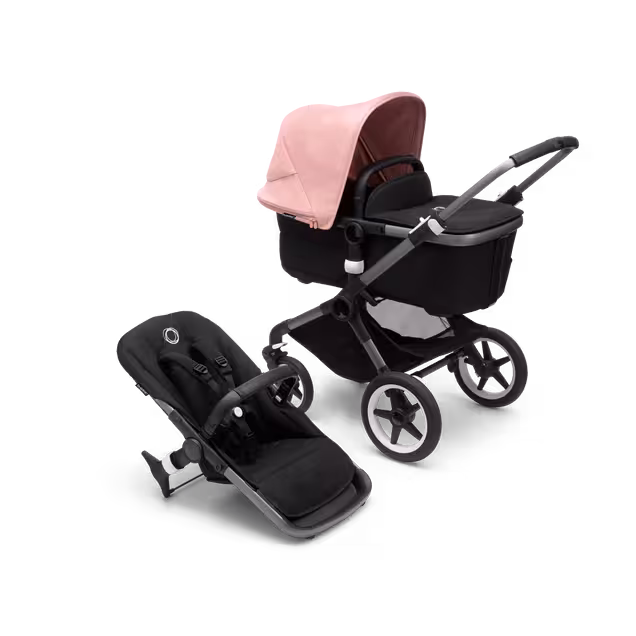 Bugaboo Fox 3 bassinet and seat stroller with graphite frame, black fabrics, and pink sun canopy. - Main Image Slide 1 of 7
