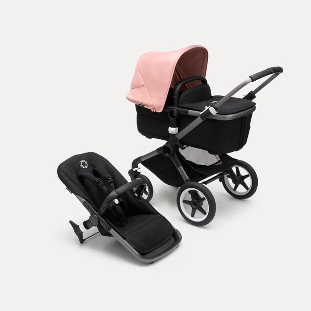 Bugaboo Fox 3 bassinet and seat stroller with graphite frame, black fabrics, and pink sun canopy. - Main Image Slide 1 of 7