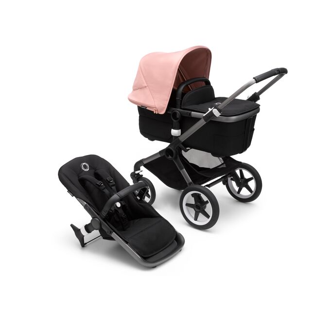 Bugaboo Fox 3 bassinet and seat stroller with graphite frame, black fabrics, and pink sun canopy. - Main Image Slide 1 of 7