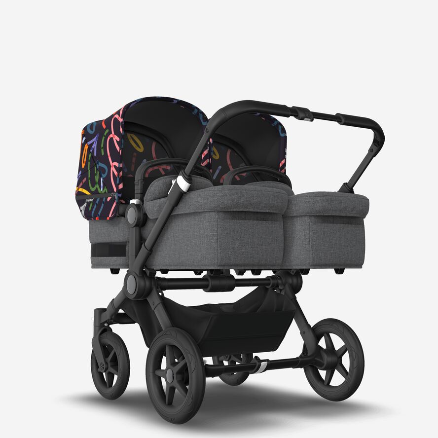 Bugaboo Donkey 5 Twin bassinet and seat stroller black base, grey mélange fabrics, art of discovery dark blue sun canopy