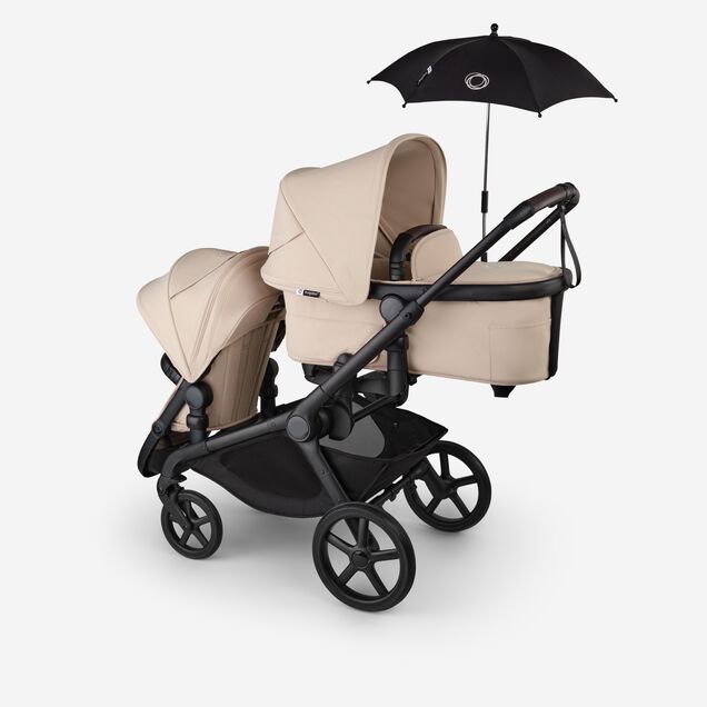 Bugaboo Kangaroo 2-in-1 tandem stroller with one bassinet above and one seat below, in Desert Taupe fabrics. A Bugaboo parasol is attached. - Main Image Slide 17 of 18